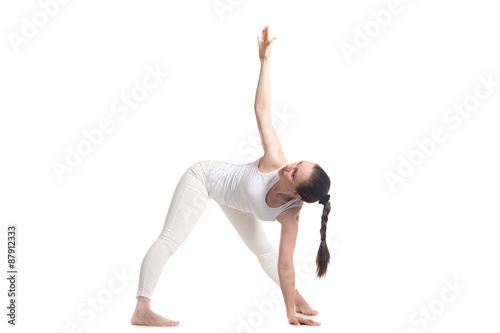 Yogi female doing Yoga trikonasana pose