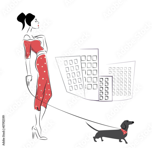 Girl walking her dachshund dog pet