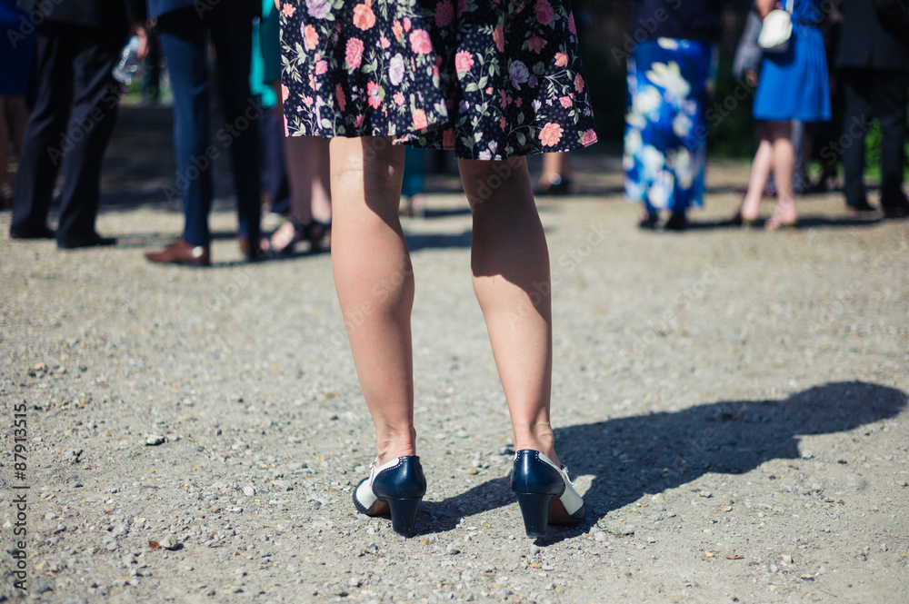 Legs of young woman at party