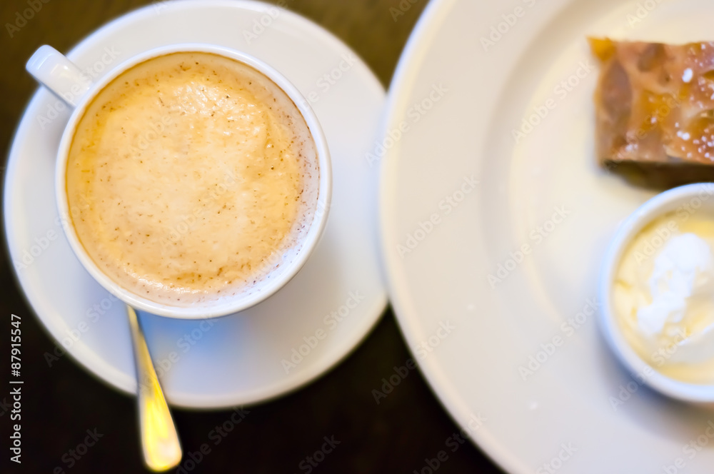 Cup of cappuccino with apple strudel and ice cream Cup of cappuccino with apple strudel and ice cream