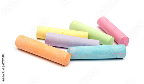 chalks in a variety of colors arranged on a white background