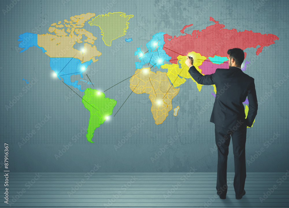 businessman drawing map on wall