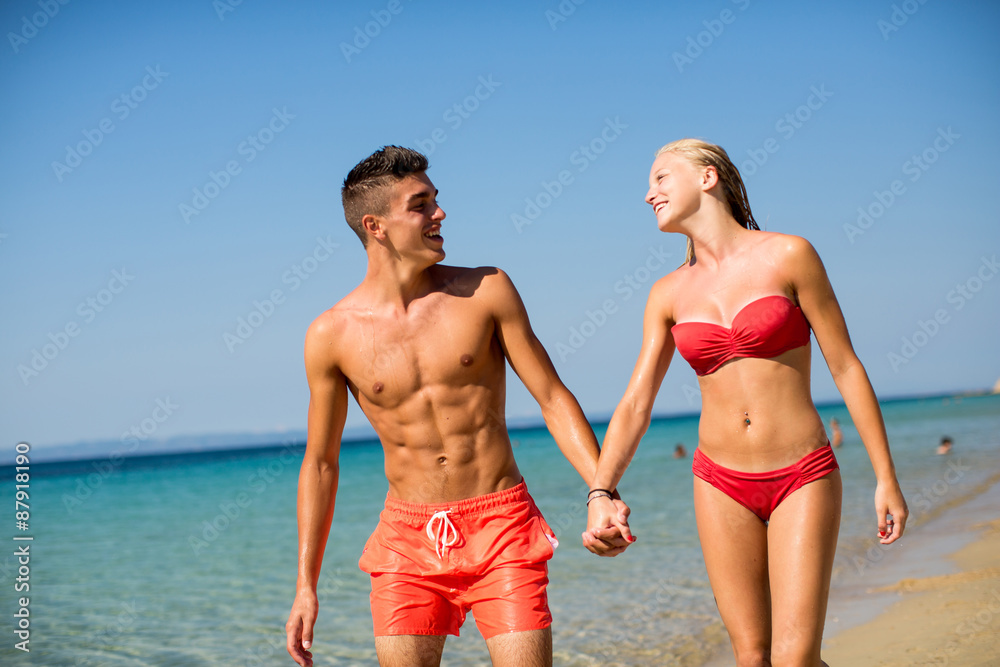 Young couple relaxing on the beach Young couple relaxing on the beach