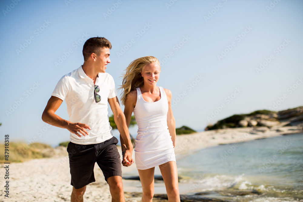 Young couple relaxing on the beach