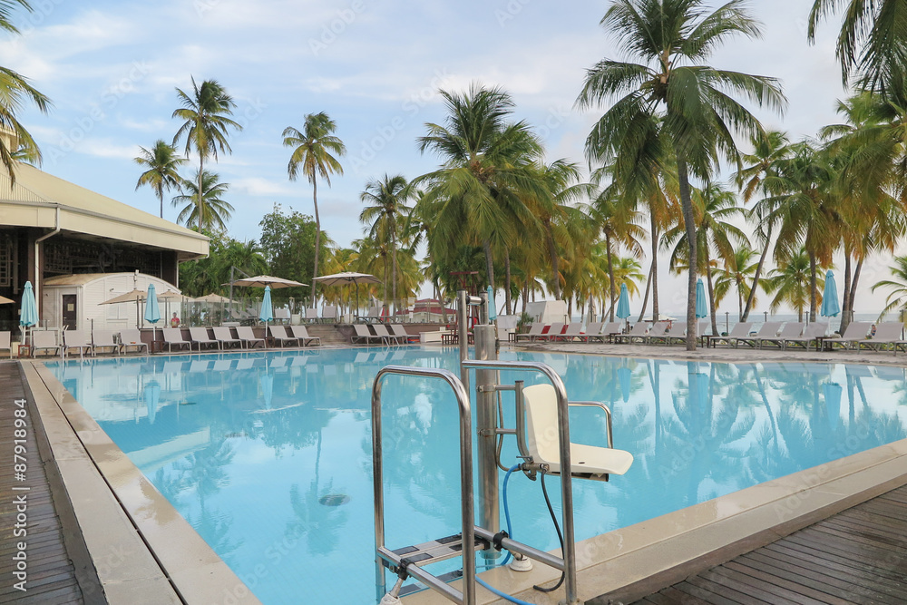 Swimming pool facing the lagoon in a tropical hotel