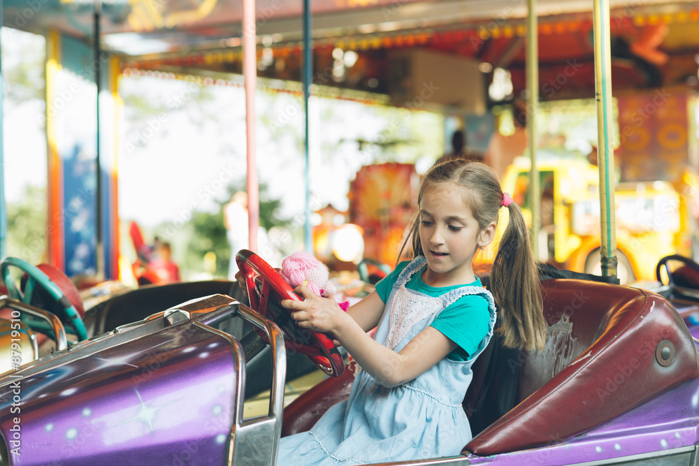 Little girl in amusement park.
