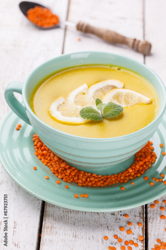 Puree soup with red lentils,with mint and lemon wedges.Traditional Turkish cuisine. Puree soup with red lentils,with mint and lemon wedges.Traditional Turkish cuisine.