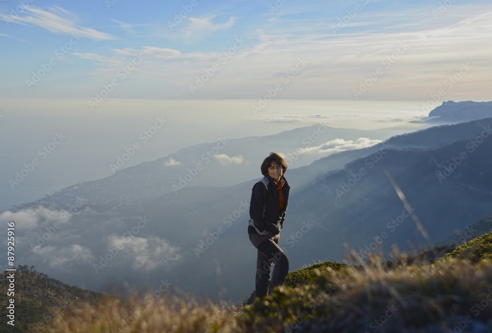 Hiker above clouds