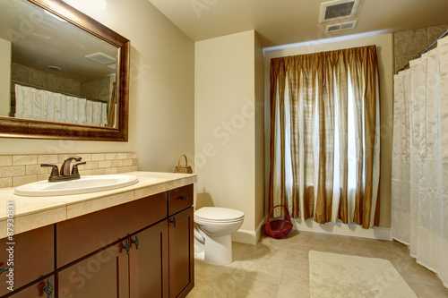 Elegant bathroom with tan enterior.