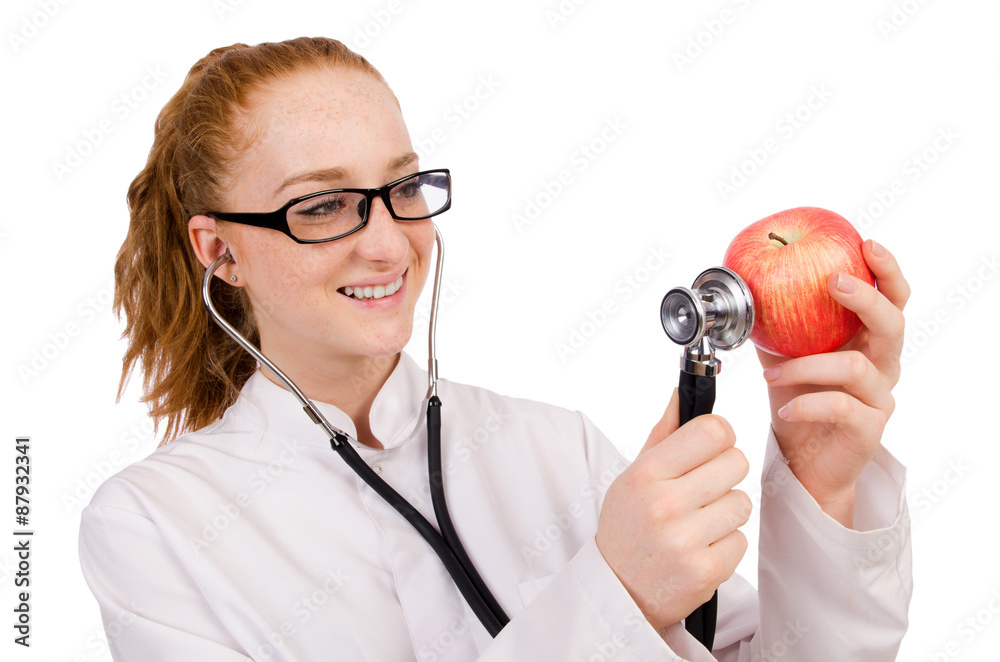 Pretty female doctor with stethoscope and apple isolated on whit Pretty female doctor with stethoscope and apple isolated on whit