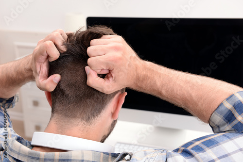 Young man with computer close up