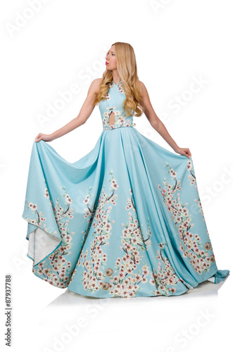 Woman in blue long dress with flower prints isolated on white photo