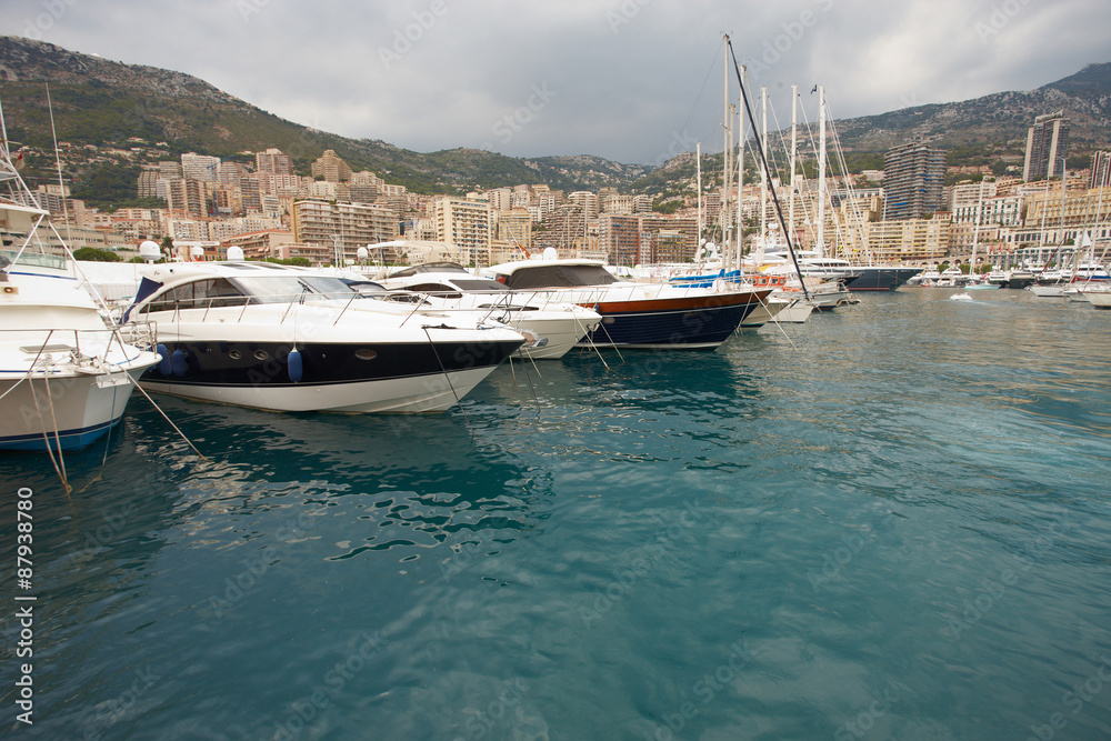 Fototapeta premium Monaco, Monte-Carlo, 29.05.2008: Port Hercule, View from water, luxury yachts in harbor of Monaco, Etats-Uni, Piscine, Hirondelle