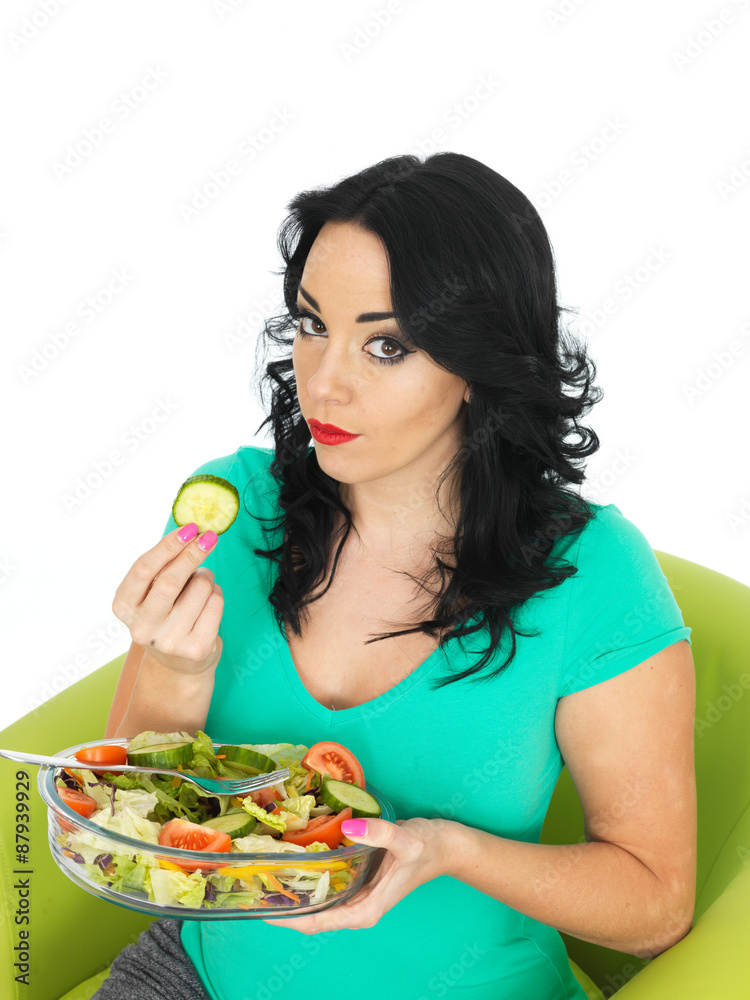 Young Woman Eating a Fresh Crisp Mixed Garden Salad Young Woman Eating a Fresh Crisp Mixed Garden Salad