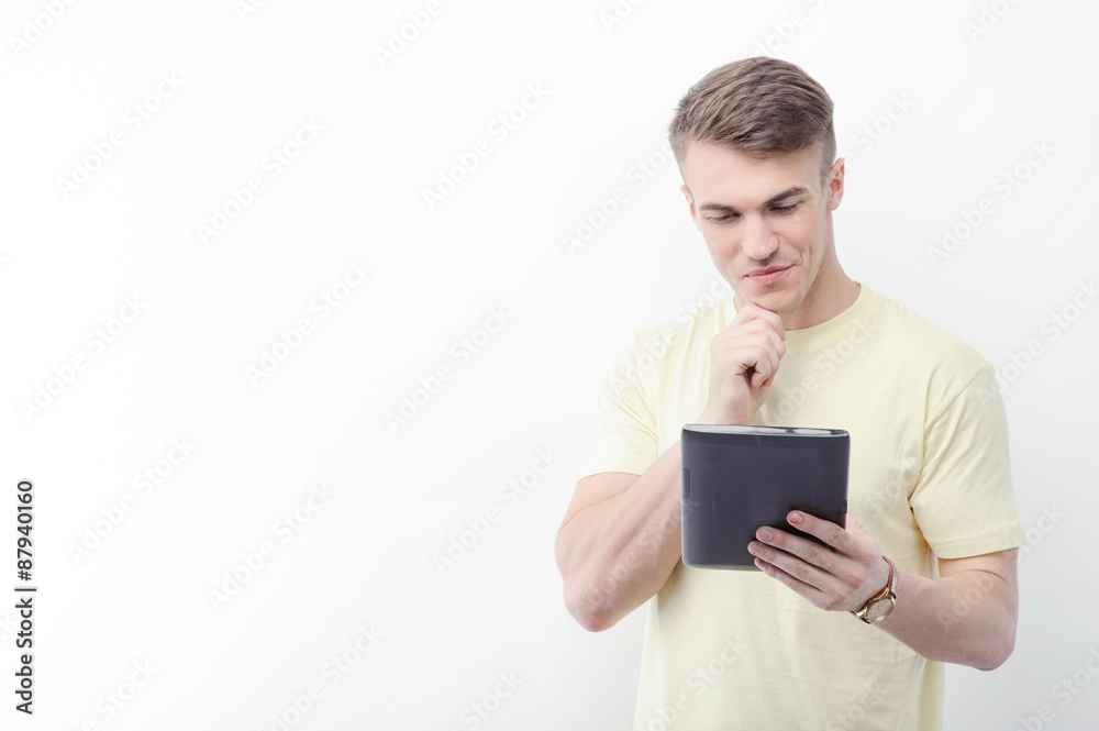 Handsome man with tablet on isolated background Handsome man with tablet on isolated background