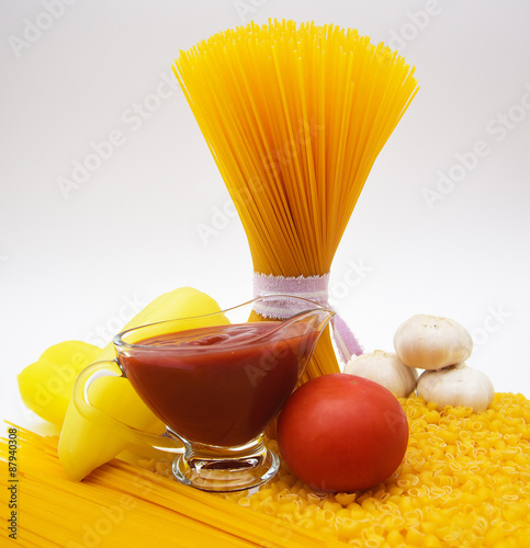 pasta, spaghetti, paper, garlic, tomato and tomato sauce  photo