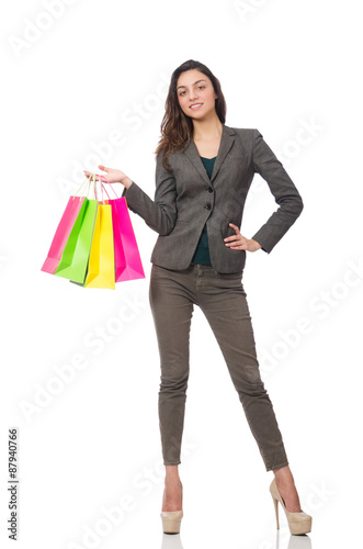 Attractive woman with shopping bags isolated on white