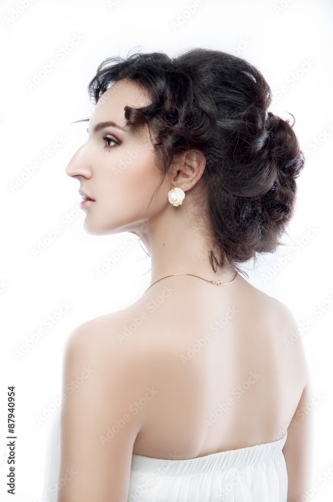 Studio portrait of a beautiful brunette with evening hairdo and Studio portrait of a beautiful brunette with evening hairdo and