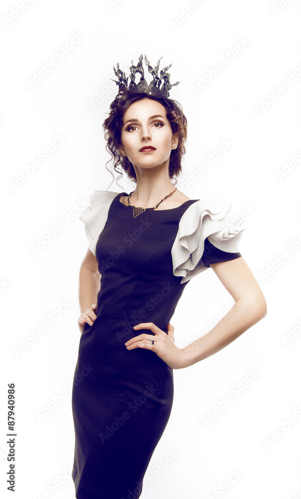 Studio portrait of a beautiful brunette with a crown Studio portrait of a beautiful brunette with a crown