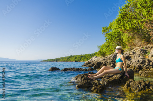 Young beautiful woman on tropical beach
