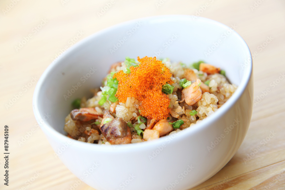 Japanese Salmon fried rice on wood background Japanese Salmon fried rice on wood background