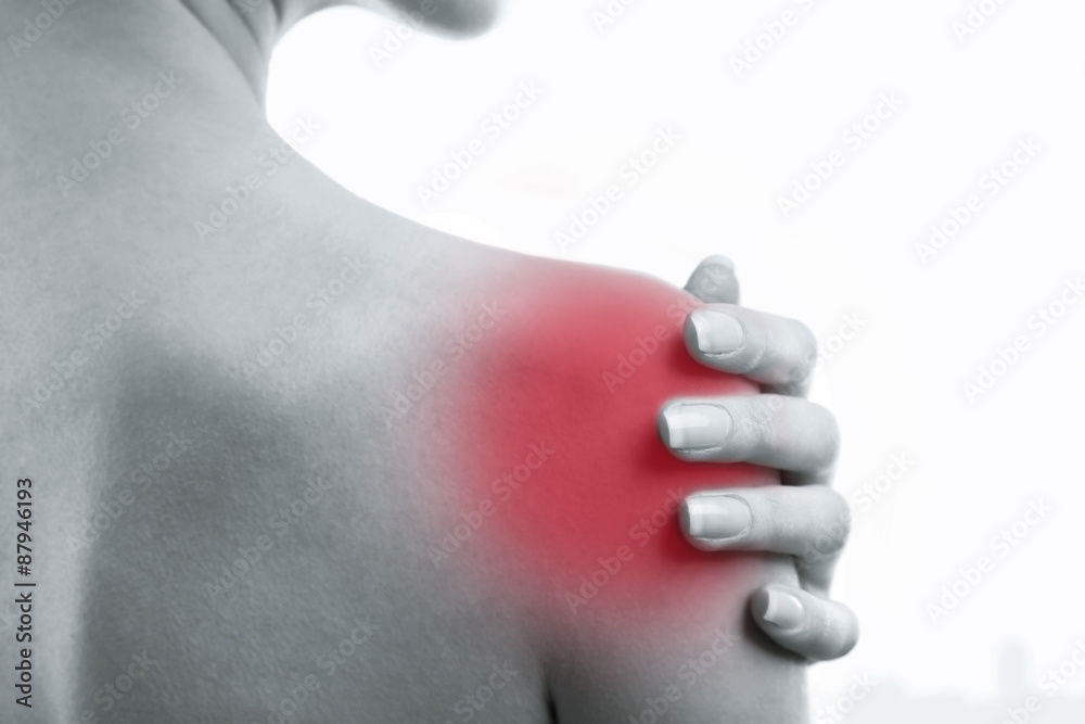 Young woman with shoulder pain close up Young woman with shoulder pain close up