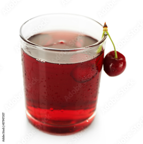 Glass of fresh juice with cherries isolated on white