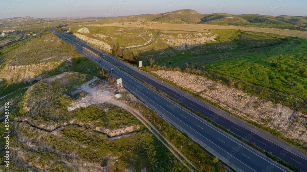 Aerial view of cars driving actively on modern highway filmed with quadrocopter Aerial view of cars driving actively on modern highway filmed with quadrocopter