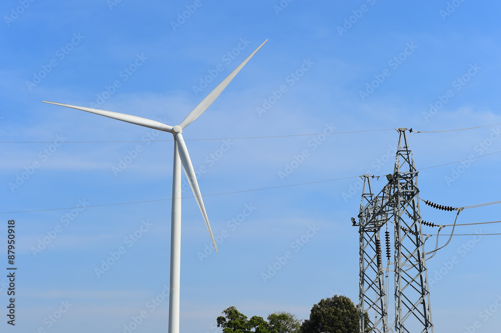 wind turbine against cloudy blue sky background wind turbine against cloudy blue sky background