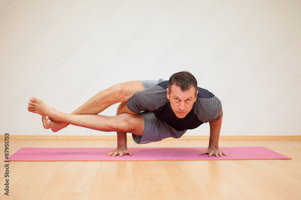 Man practicing some yoga Man practicing some yoga