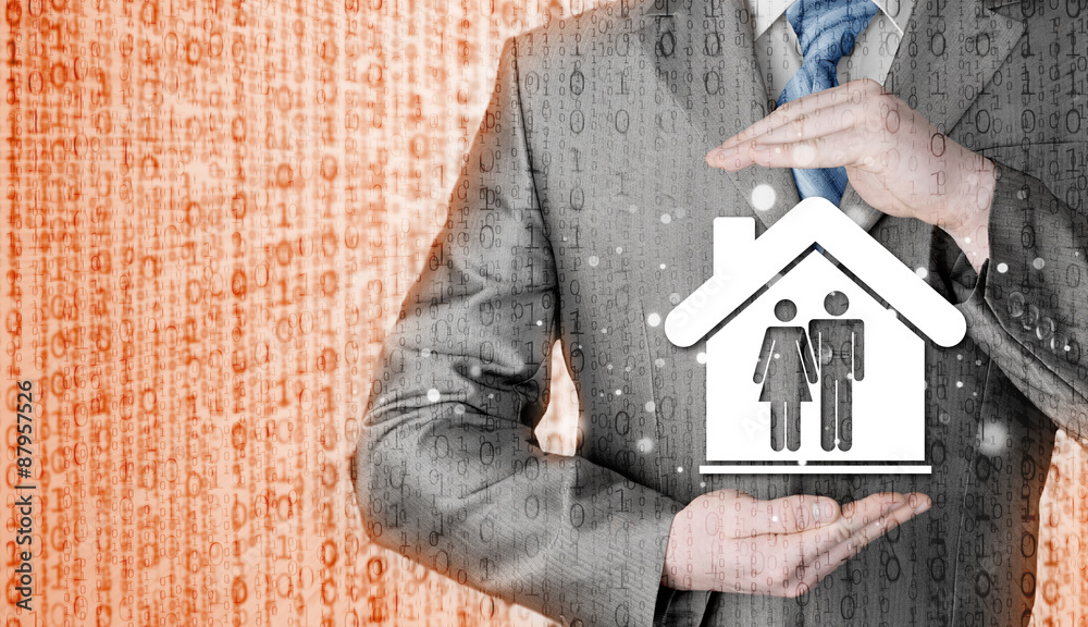 businessman protecting family in home with hands businessman protecting family in home with hands