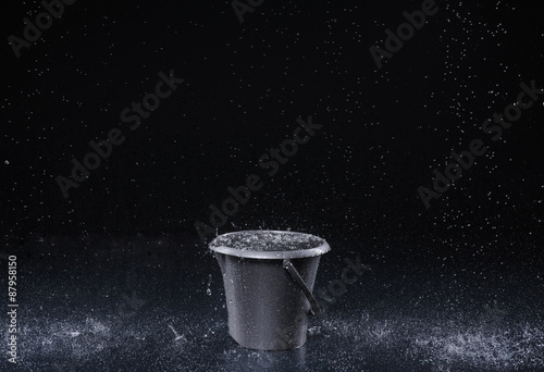 Bucket with water drops