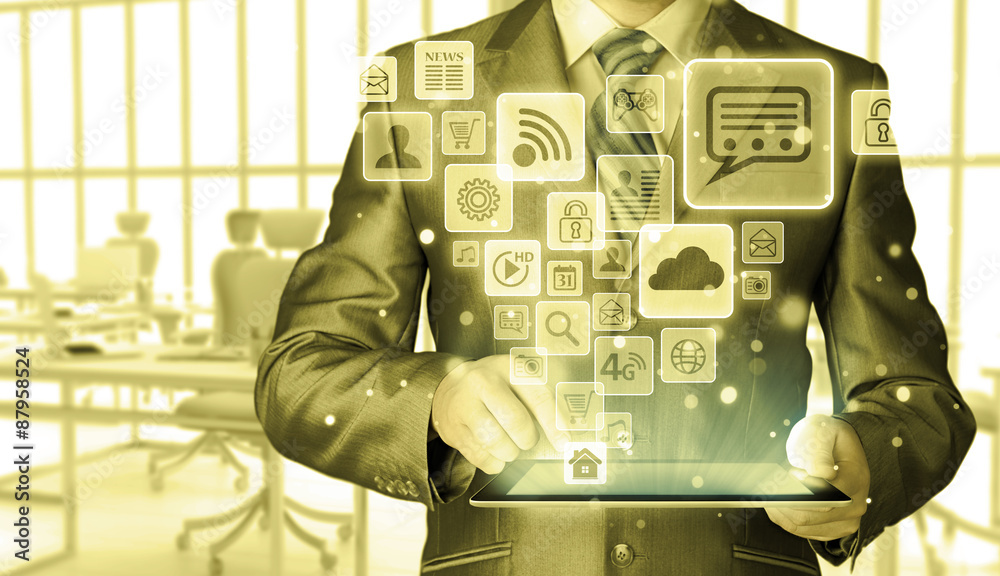 Business man using tablet PC with social media icon set Business man using tablet PC with social media icon set
