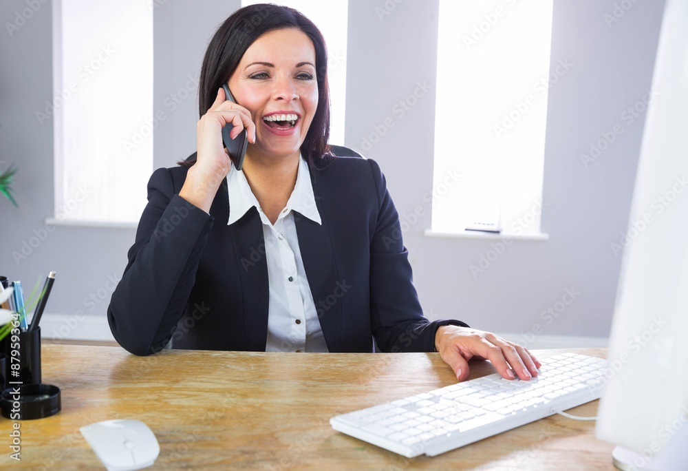 Businesswoman working at her desk Businesswoman working at her desk
