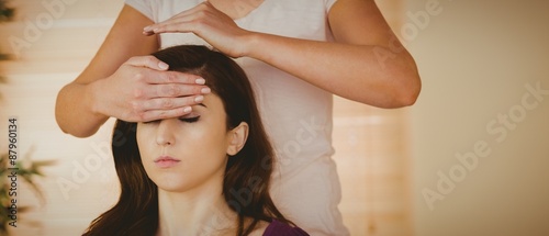 фотографія Young woman having a reiki treatment