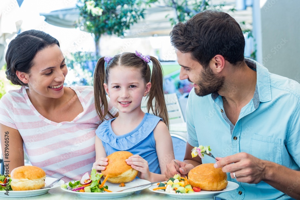 © WavebreakmediaMicro - A family eating at the restaurant © WavebreakmediaMicro - A family eating at the restaurant