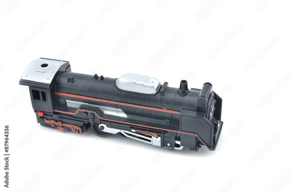 old and dusty look toy train head with red stripe form left to right view isolated white background old and dusty look toy train head with red stripe form left to right view isolated white background