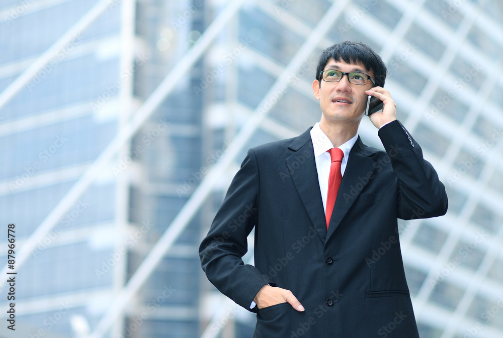 Man on smart phone - young business man. Casual urban profession Man on smart phone - young business man. Casual urban profession