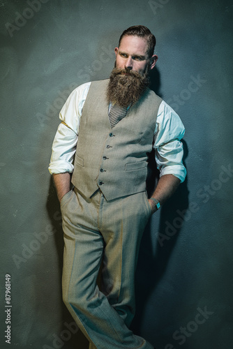 Pensive Bearded Man with Hands in the Pockets