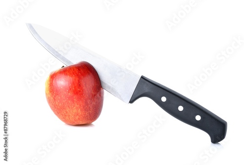 knife chop up apple on white background photo