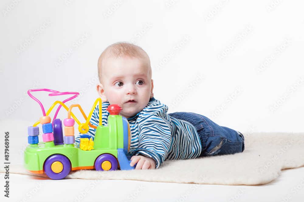 Cheerful baby in fashionable clothes on a white background Cheerful baby in fashionable clothes on a white background