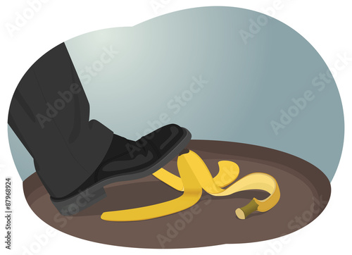 Business risk. Businessman about to step on banana peel.