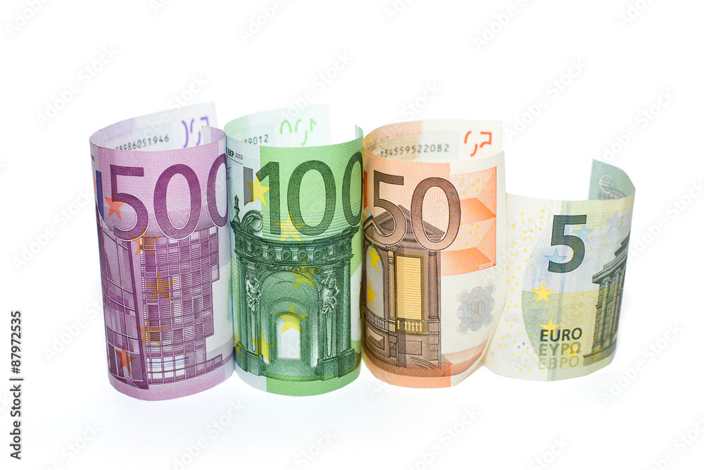 Euro banknotes of various denominations on a white background Euro banknotes of various denominations on a white background