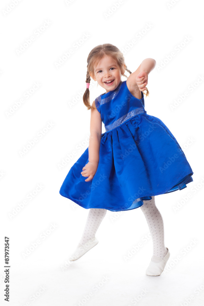 beautiful little girl in a blue dress dancing beautiful little girl in a blue dress dancing