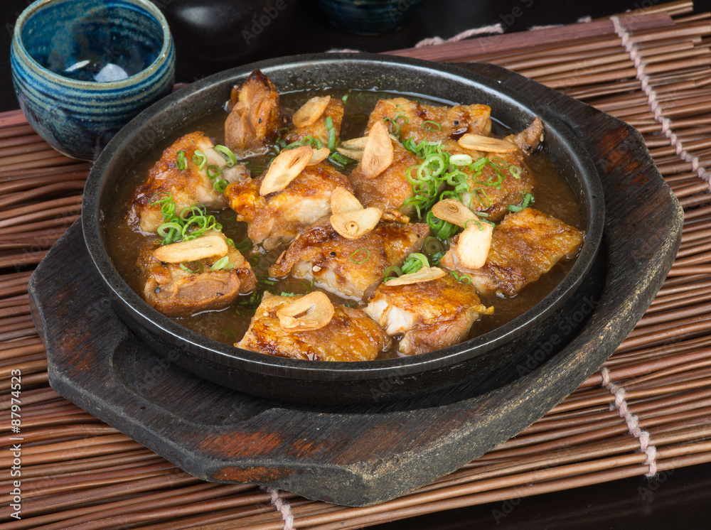 japanese cuisine. hot plate chicken on the background japanese cuisine. hot plate chicken on the background
