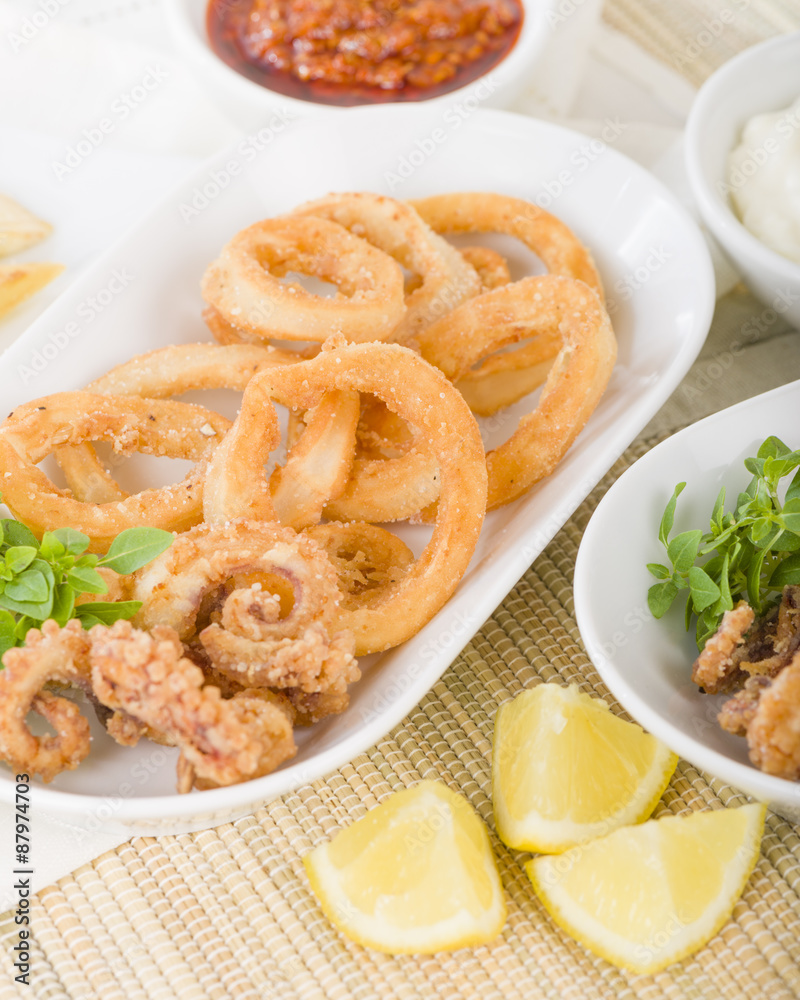 Calamari - Deep-fried squid rings served with garlic mayo and chili sauce.
