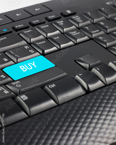 Blue buy button on keyboard.
