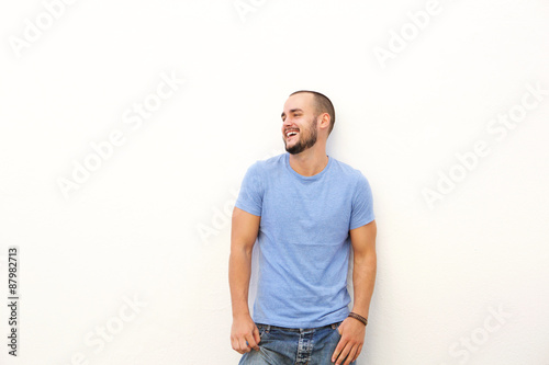 Young man with blue shirt laughing