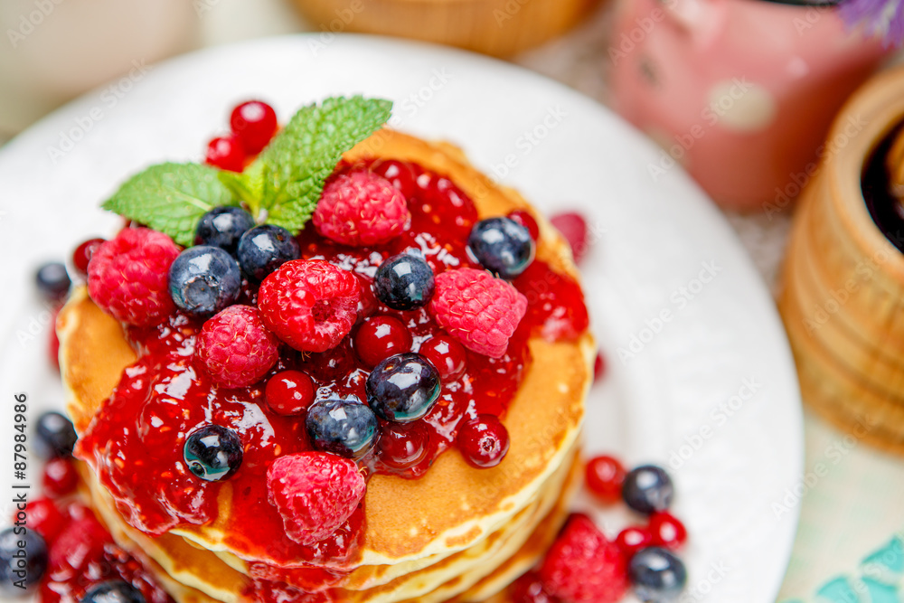 Stack of pancakes on wooden background Stack of pancakes on wooden background