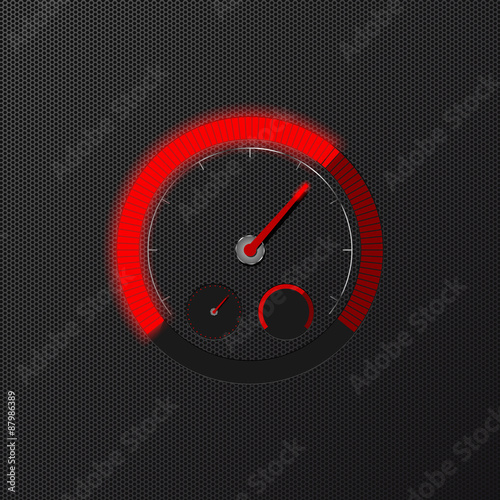 Red speedometer on carbon background